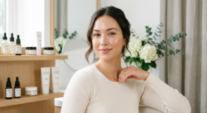 A professional, high-end editorial shot of a woman with glowing, clear skin and a soft-focus aesthet